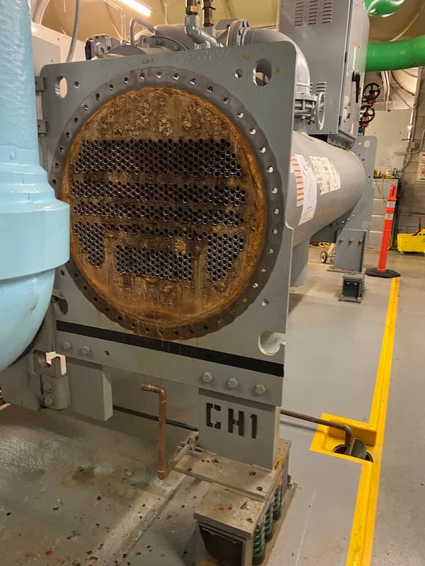 Corroded chiller tube sheet before Belzona repair in Seattle office building