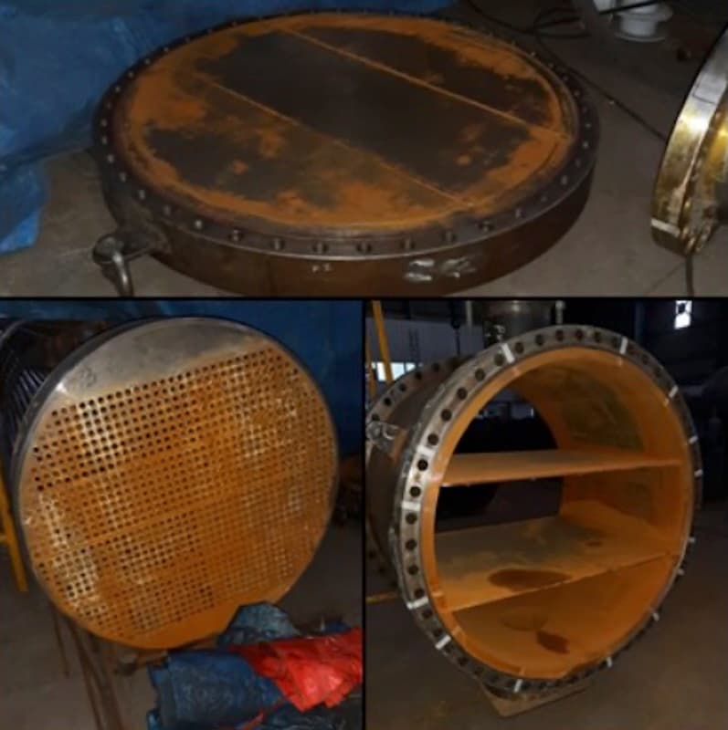 Heat exchanger before repair showing corroded tube sheet