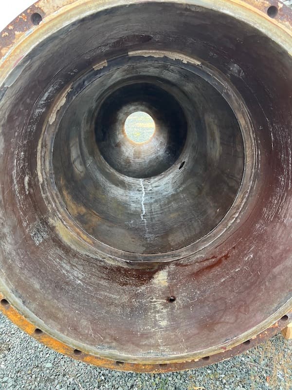 Eroded slurry transfer pipe interior before Belzona repair