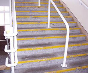 Damaged and worn steps creating slip hazard